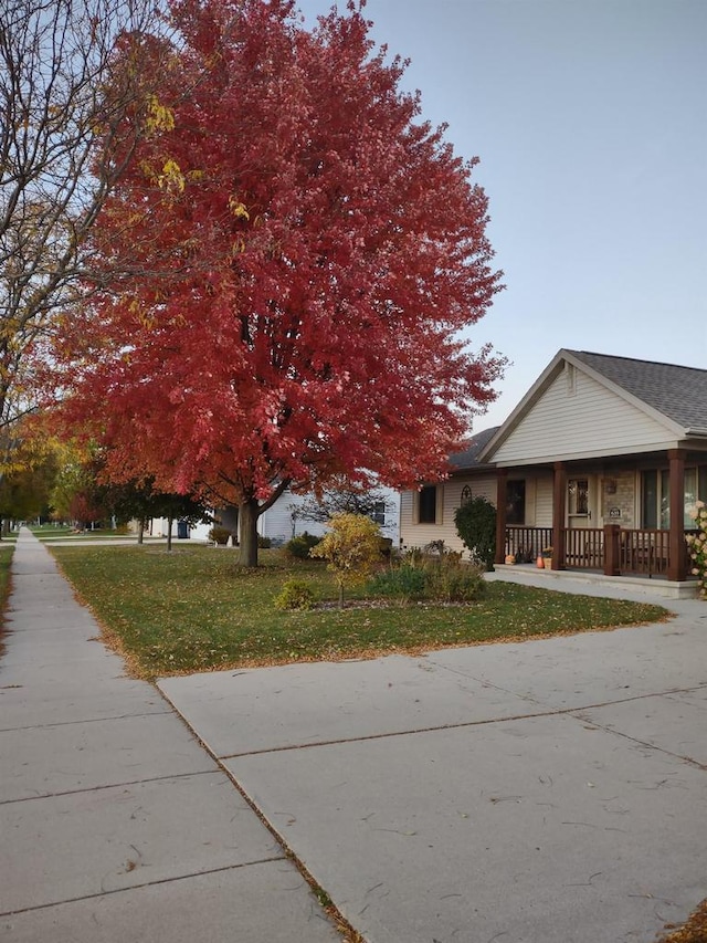 exterior space with a yard and covered porch