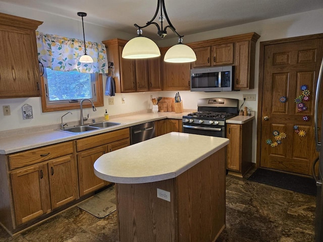 kitchen featuring a sink, appliances with stainless steel finishes, and light countertops