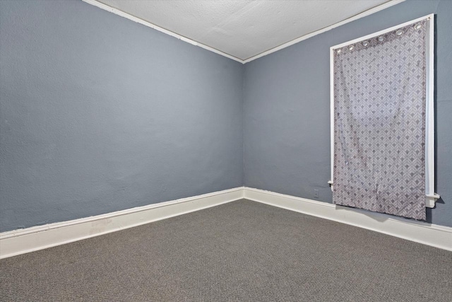 unfurnished room featuring a textured ceiling, carpet, and ornamental molding