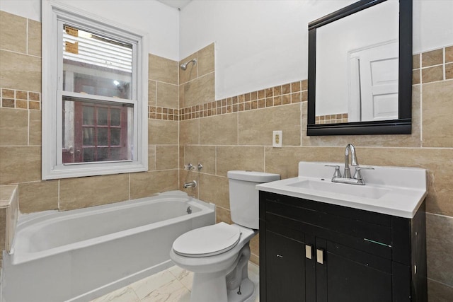 bathroom featuring tile walls, toilet, shower / tub combination, marble finish floor, and vanity