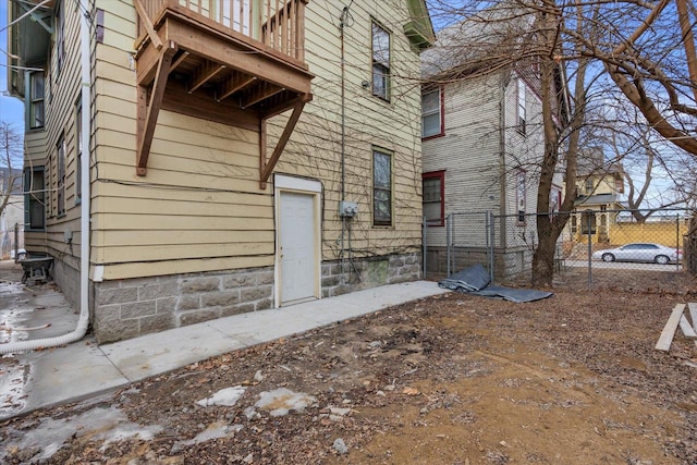 entrance to property featuring fence