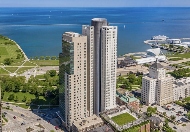 aerial view featuring a view of city and a water view