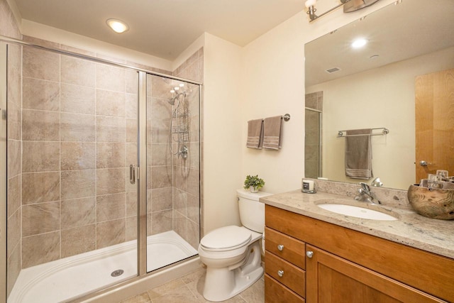 bathroom with vanity, visible vents, a stall shower, tile patterned floors, and toilet