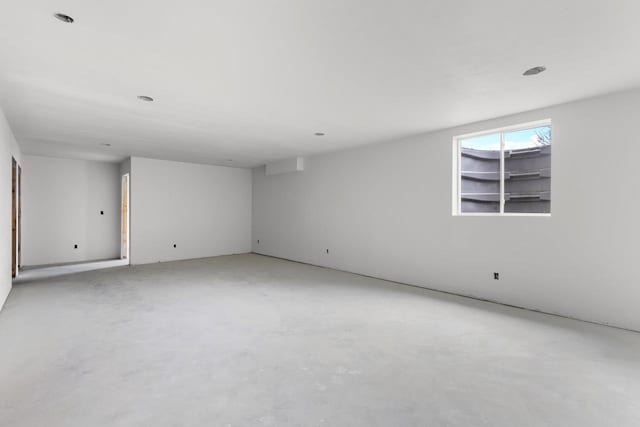 spare room with concrete floors