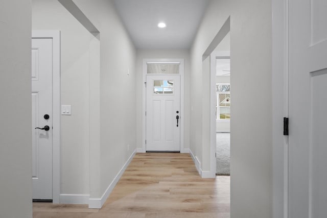 entryway featuring light wood-type flooring and baseboards