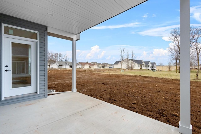 view of patio with a residential view