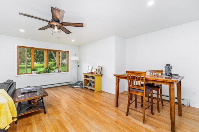 interior space with recessed lighting, baseboard heating, light wood-style flooring, and ceiling fan