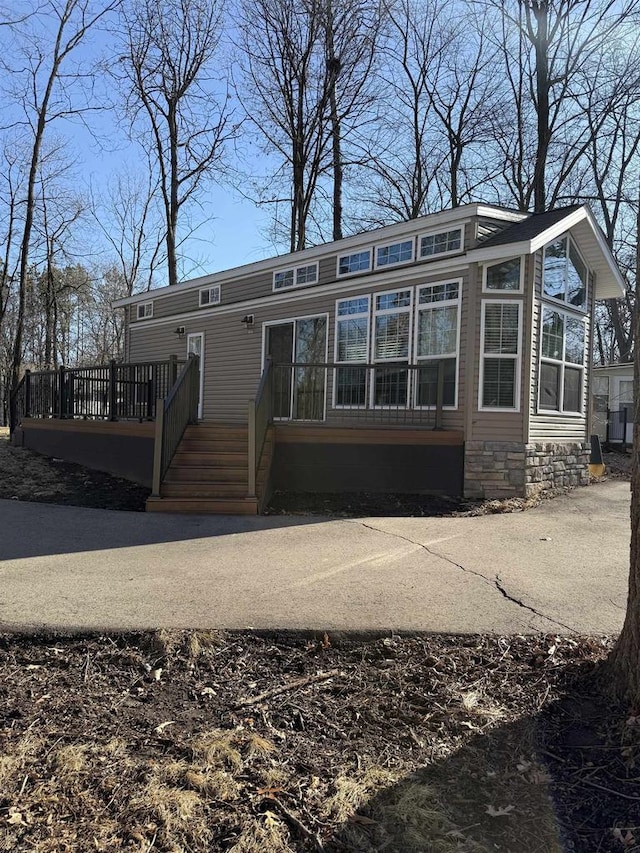 view of front of property with a wooden deck