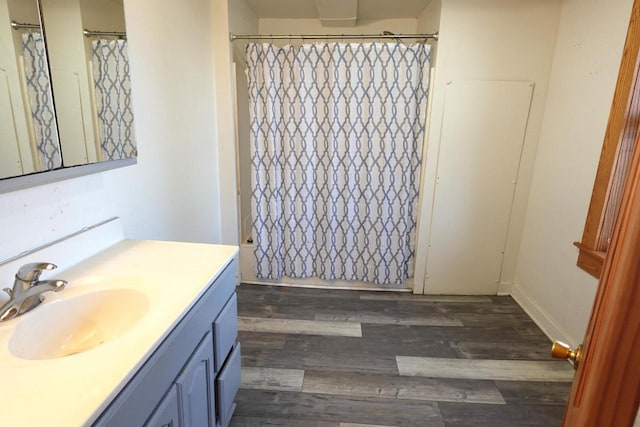 bathroom with vanity and wood finished floors