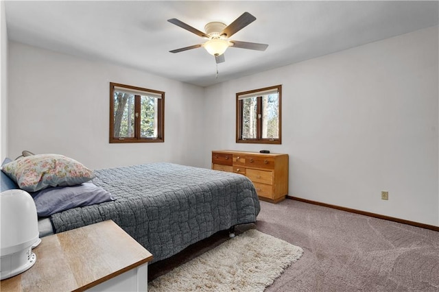 bedroom featuring light carpet, ceiling fan, and baseboards