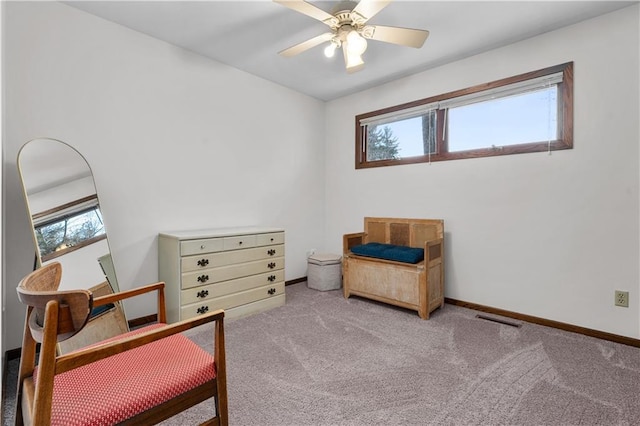 sitting room with a wealth of natural light, visible vents, carpet flooring, and baseboards