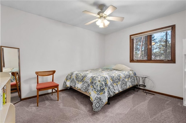 carpeted bedroom with a ceiling fan and baseboards