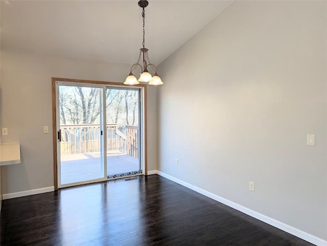 unfurnished room with lofted ceiling, baseboards, dark wood-style flooring, and a chandelier