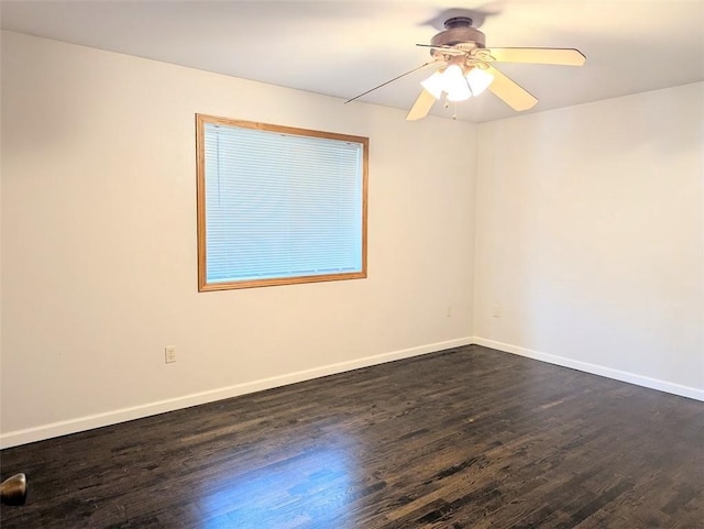 unfurnished room with baseboards, ceiling fan, and dark wood-style flooring