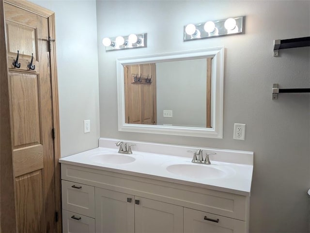 bathroom featuring double vanity and a sink