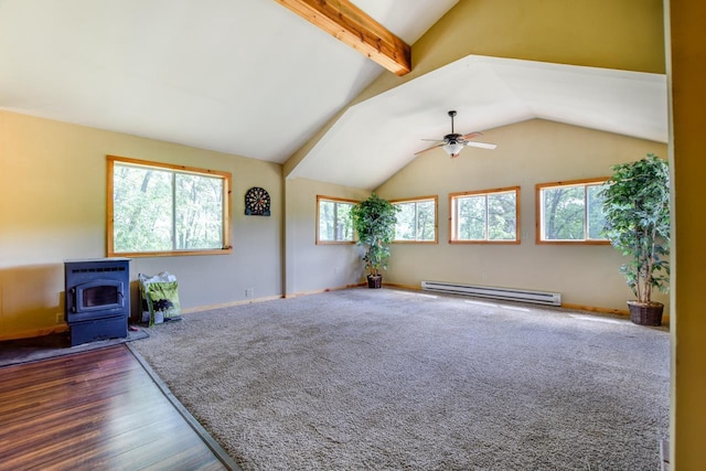 unfurnished living room featuring a ceiling fan, baseboards, lofted ceiling with beams, a wood stove, and baseboard heating