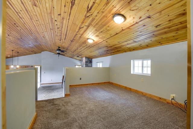 bonus room with carpet, baseboards, wood ceiling, vaulted ceiling, and a ceiling fan