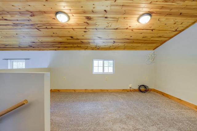 bonus room featuring carpet flooring, wooden ceiling, baseboards, and vaulted ceiling