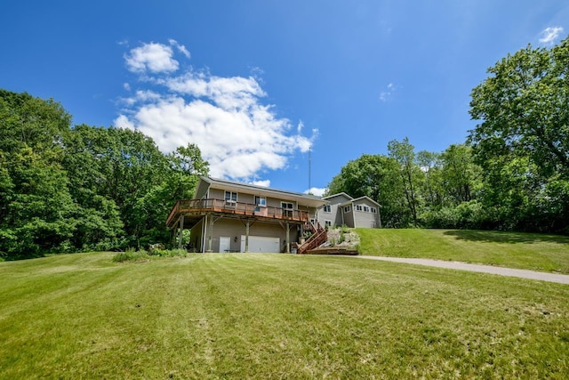 back of property featuring a deck and a yard