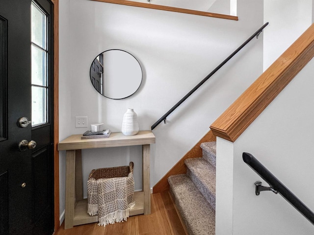 entryway with stairs and wood finished floors