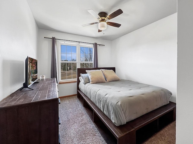 bedroom with baseboards, carpet floors, and ceiling fan