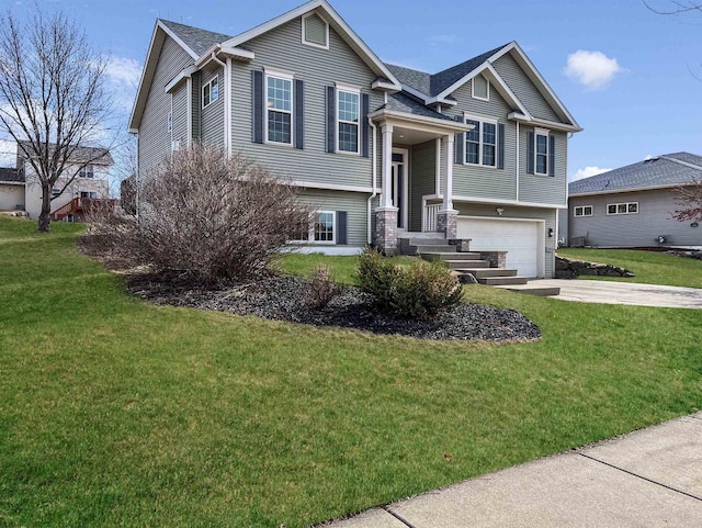 bi-level home with driveway, an attached garage, and a front lawn