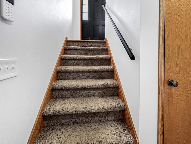 stairway with baseboards