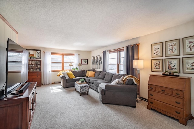 living area with light carpet and a textured ceiling