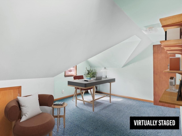 carpeted home office with baseboards and vaulted ceiling