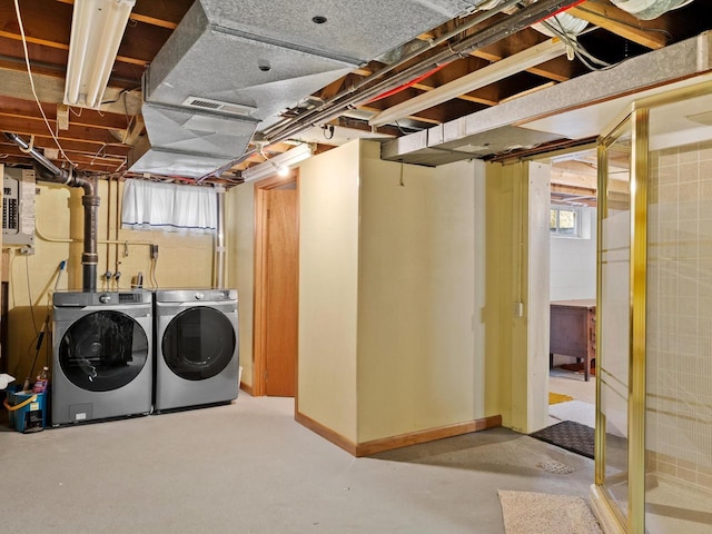 basement featuring separate washer and dryer and visible vents