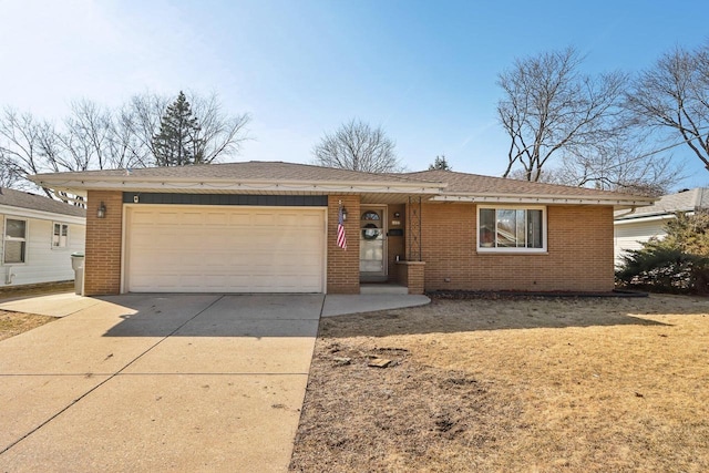 ranch-style home featuring brick siding, a garage, driveway, and roof with shingles