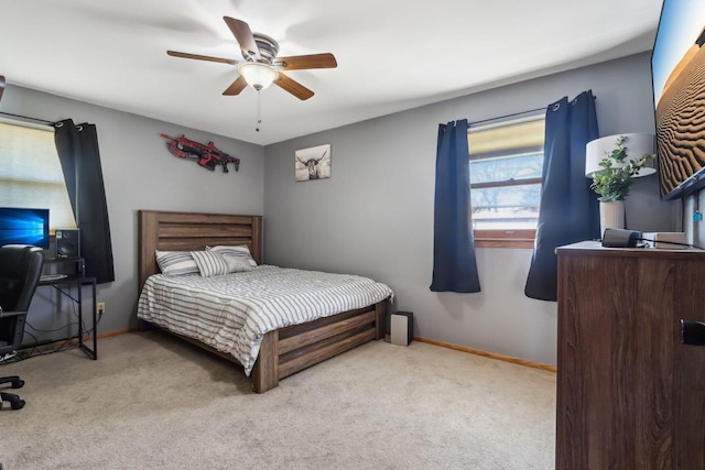 bedroom with baseboards, carpet, and a ceiling fan