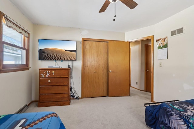 bedroom with carpet flooring, a ceiling fan, visible vents, and a closet