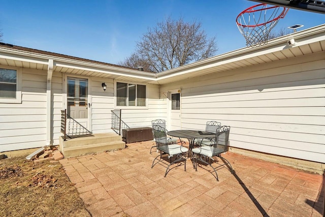 view of patio featuring entry steps and outdoor dining area