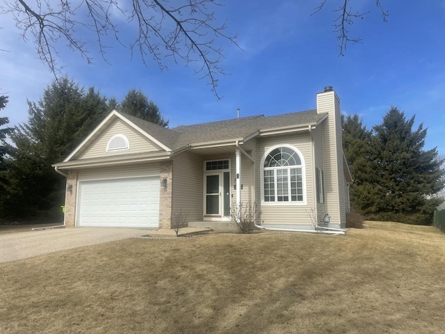 ranch-style home featuring driveway, an attached garage, a chimney, a front lawn, and brick siding