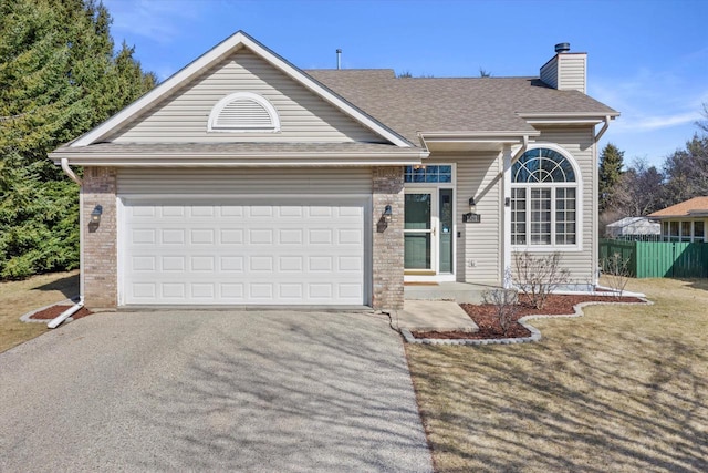 ranch-style home featuring brick siding, fence, a chimney, a garage, and driveway