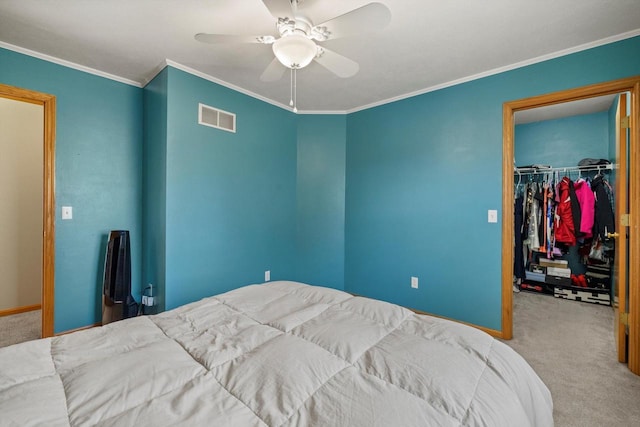 bedroom with visible vents, carpet floors, a closet, and a spacious closet