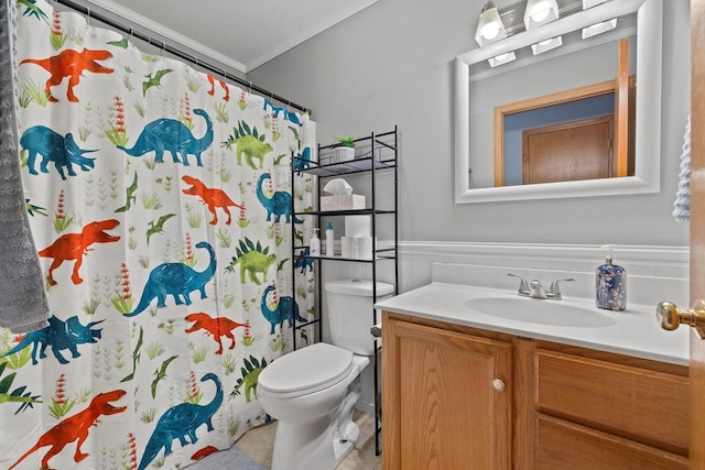 bathroom featuring tile patterned flooring, toilet, wainscoting, a shower with curtain, and vanity