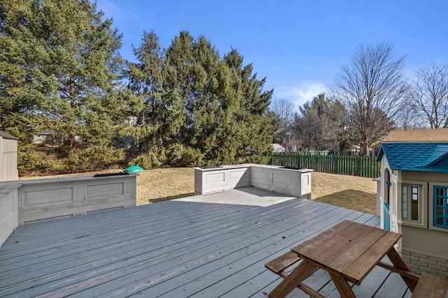 wooden terrace featuring fence