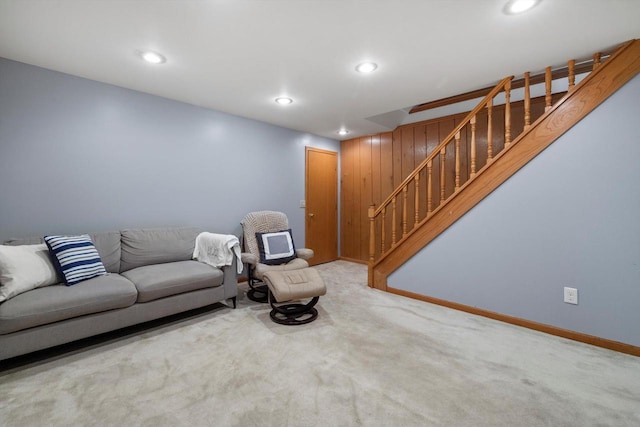 unfurnished living room with stairway, recessed lighting, baseboards, and carpet floors