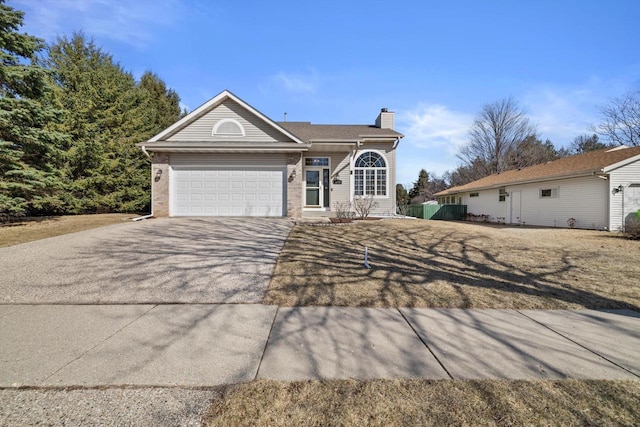 ranch-style house featuring concrete driveway, brick siding, a garage, and a chimney