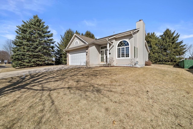 single story home featuring a front yard, an attached garage, driveway, and a chimney