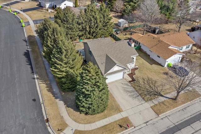 birds eye view of property with a residential view