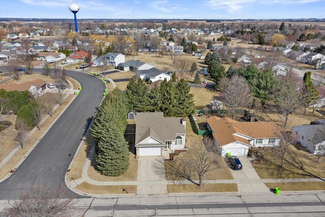 birds eye view of property with a residential view