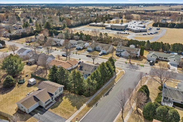 birds eye view of property with a residential view