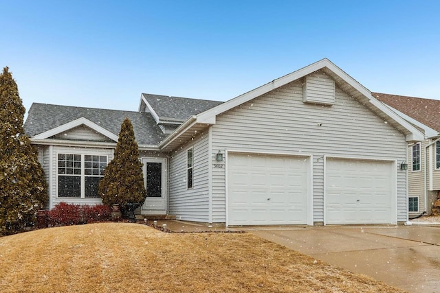 view of front of home with an attached garage and driveway