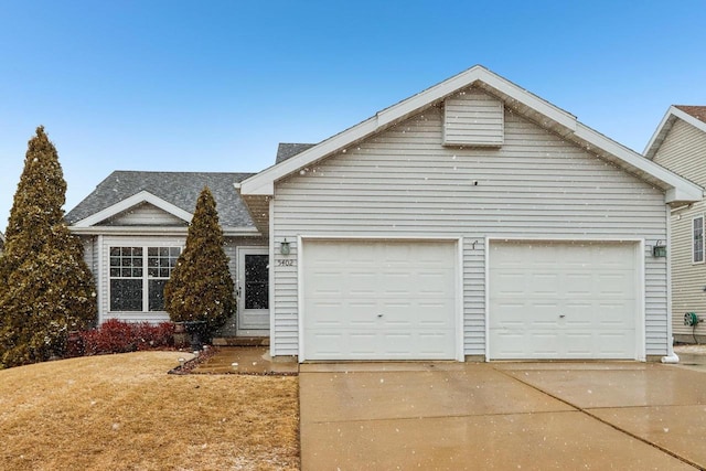 view of front facade featuring an attached garage and driveway