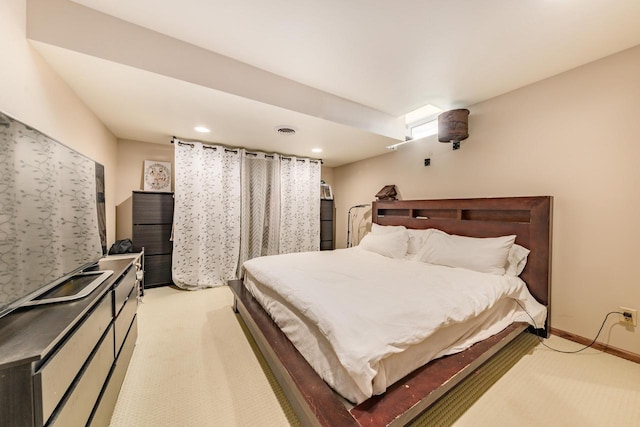 bedroom featuring visible vents, recessed lighting, light colored carpet, and baseboards