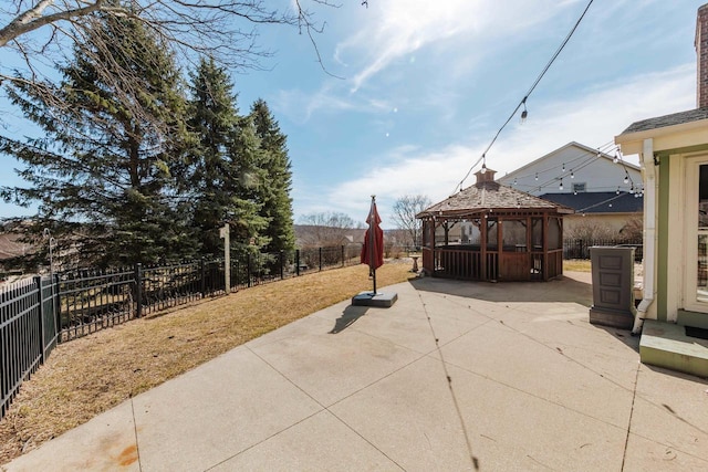 view of patio / terrace featuring a gazebo and a fenced backyard