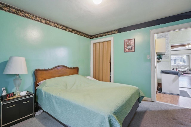 carpeted bedroom with baseboards